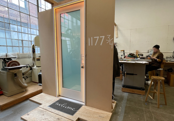 Image of Smart Entry door standing in a workshop